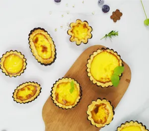 Household multi-size egg tart molds set, non-stick round flower-shaped baking tools for oven.