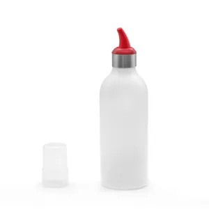Squeeze condiment bottle with red silicone nozzle and clear cap for kitchen use.