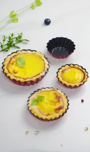 Detail view of non-stick multi-size egg tart molds set, showing flower-shaped baking pans.