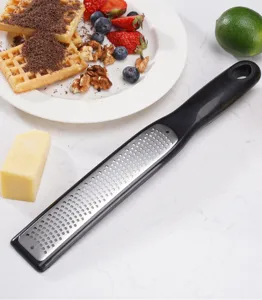Multi-functional cheese grater and lemon zester with stainless steel blade and comfy handle.
