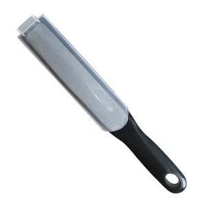 Stainless steel multi-functional cheese grater and lemon zester with protective cover.