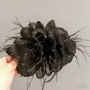 Extra large black flower hair claw clip with sheer mesh petals, sparkle dots and feather trim.