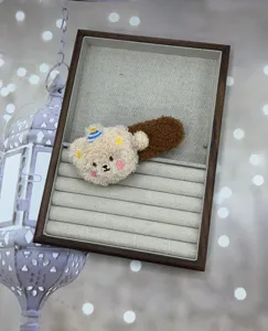 Cute plush bear hairpin detail view, soft autumn winter hair clip with sweet cartoon bear design.