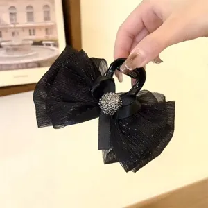 Black mesh bow hair claw clip sparkling detail elegant half-tied hair accessory detail view