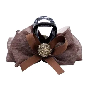 Fluffy bubble bow hair claw clip for women, elegant half updo hairpin headwear fashion accessory.