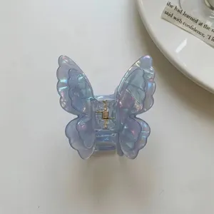 Transparent iridescent butterfly hair claw clip with metal spring for women girls daily wear.