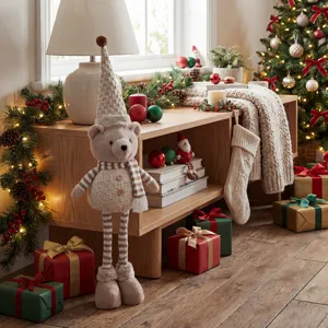 Christmas plush bear decoration with knit hat and extendable legs for holiday home indoor decor.
