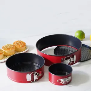 Red springform cake pan set, round non-stick carbon steel baking mold with removable bottom.