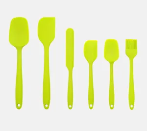 Close-up details of green silicone baking spatulas set, seamless flexible cooking tools.