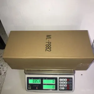 Details of Christmas tree star angel topper packaging box showing weight for shipping verification.