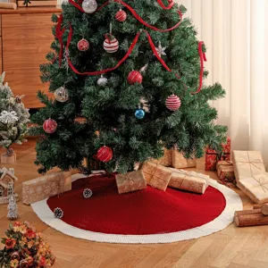 Knitted Christmas tree skirt, red with white border, round holiday tree base decoration.