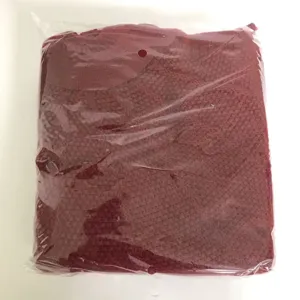 Red knitted Christmas tree skirt holiday decoration packaged in clear bag for festive display