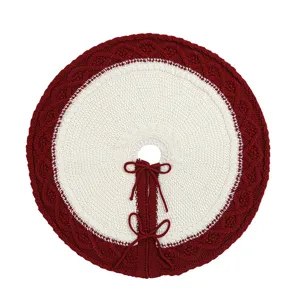 Knitted Christmas tree skirt with red border and white diamond pattern for holiday decor main view