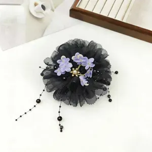Black mesh flower hair claw with pearl tassel details, elegant hair accessory for styling.