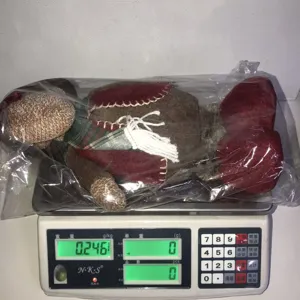 Detail view of Christmas telescopic plush reindeer doll in packaging on scale, weight 0.246kg