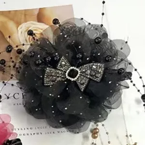 Large black mesh flower hair clip with sparkling rhinestone bow and pearl beads for women.