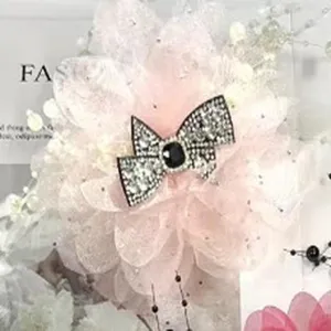 Oversized pink peony hair claw clip with sparkly crystal bow for women elegant daily wear.
