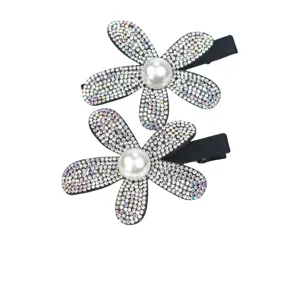 Sparkling rhinestone flower hair clip detail, dazzling crystal petals and pearl center.