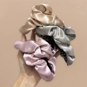 Oversized satin hair claw clips for women, elegant pleated shark clip hairpin for thick hair styling.