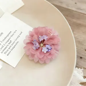 Pink organza flower hair claw clip elegant floral hair accessory for women styling.