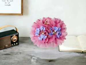 Large pink flower hair claw clip with purple details and pearls for elegant hairstyles daily wear.