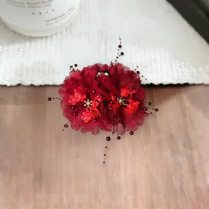 Burgundy fabric flower hair claw clip with bead tassels for elegant women updos.