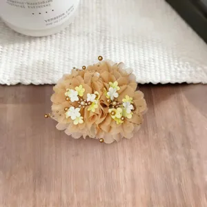 Elegant chiffon peony flower hair claw clip with delicate pearl beads and gold chains detail.
