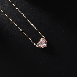 Elegant rose gold necklace featuring a blue crystal pave heart pendant for women style.