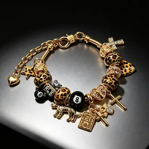 Pulsera de dijes de leopardo dorados retro con colgantes de bola 8 y cruz estilo punk.