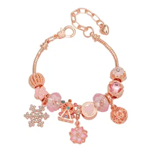 Rose gold charm bracelet featuring sweet cherry blossom and snowflake pendants for women gifts.