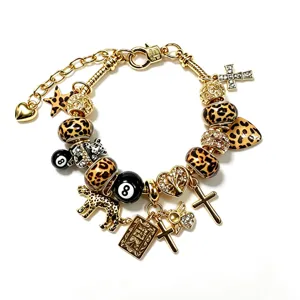Pulsera de dijes con estampado de leopardo retro con bola de 8 y cruz joyería de moda.