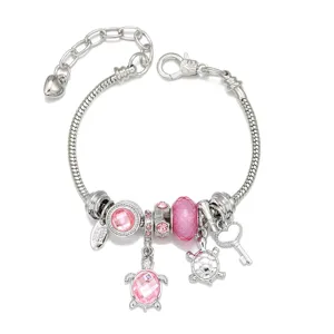 Ocean style charm bracelet featuring cute turtle pendants, pink crystal beads, and silver snake chain.