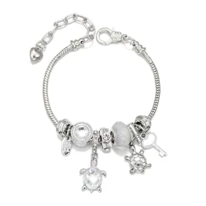 Silver charm bracelet with cute sea turtle pendants, sparkling crystal beads and snake chain design.