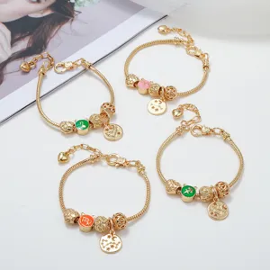Gold plated snake chain charm bracelet set featuring zodiac sign beads and metal pendants.