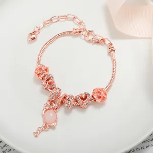 Bracciale con ciondoli in oro rosa con fenicottero e cuori scintillanti gioielli alla moda