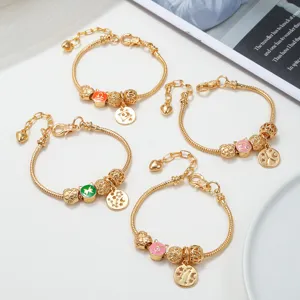 Pandora style gold snake chain charm bracelet featuring zodiac constellation pendants.