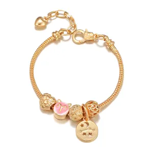 Gold plated charm bracelet with snake chain, pink Aries zodiac bead and star moon pendant.