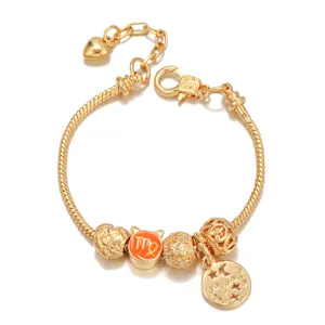 Gold tone snake chain charm bracelet detailed with constellation and zodiac beads for women.