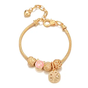 Gold plated snake chain charm bracelet with zodiac constellation beads and cute pink enamel charms.