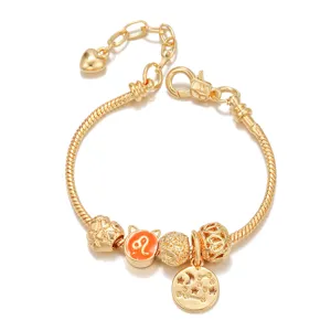 Gold-plated snake chain DIY charm bracelet with zodiac Leo bead and heart extension.