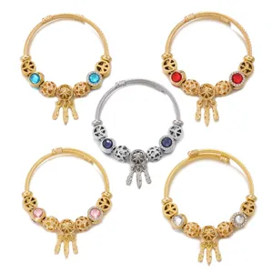 Stainless steel open bangle bracelet set with dreamcatcher feather charm and colorful crystal beads.