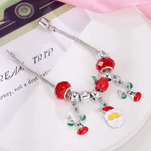 Christmas charm bracelet with red glass beads, Santa, reindeer and apple pendants.