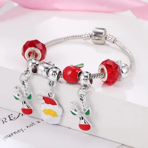 Christmas charm bracelet with red glass beads, Santa and reindeer pendants for women detail view.