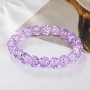 Purple cracked crystal beaded bracelet, elegant 10mm round stone fashion jewelry detail.