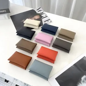 Close-up of colorful genuine leather card holders in various vibrant shades, neat display.