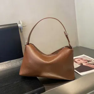Classic brown leather shoulder bag for women, minimalist hobo design with premium texture.