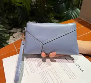 Genuine leather women's clutch bag with wrist strap, elegant blue daily casual purse, detail view