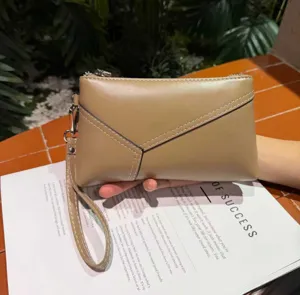 Genuine leather wristlet clutch bag for women, retro casual phone purse and coin pouch.