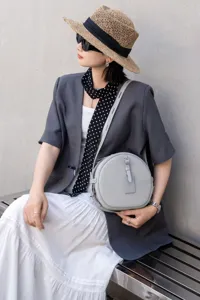 Light grey leather round crossbody bag, vintage circle shoulder bag for women daily commute.