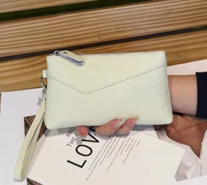 Genuine leather clutch purse for women, minimalist zipper wristlet wallet with strap.